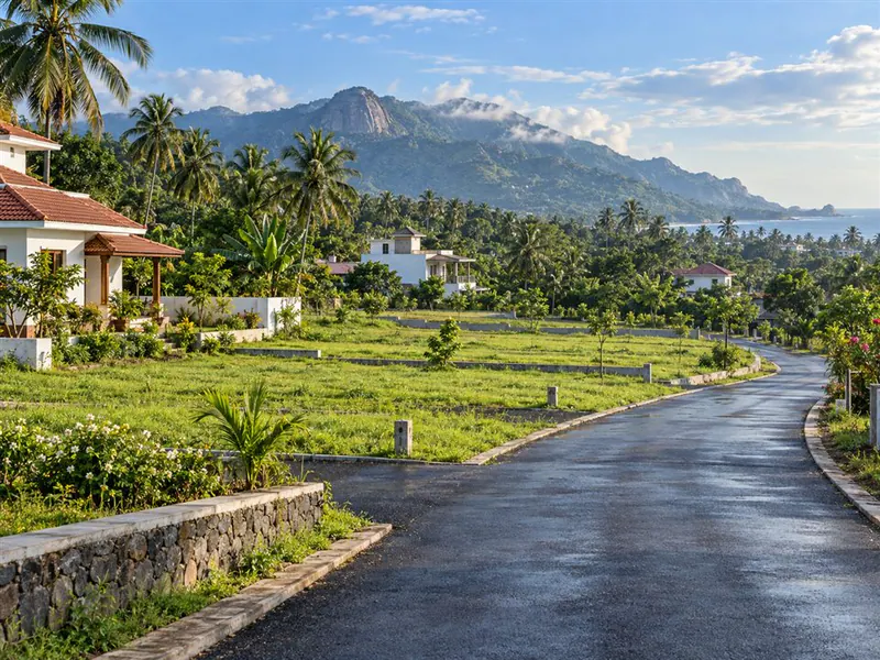 Green residential plots and an access road in Kanyakumari district